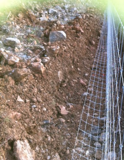 Clôture avec rabat au sol